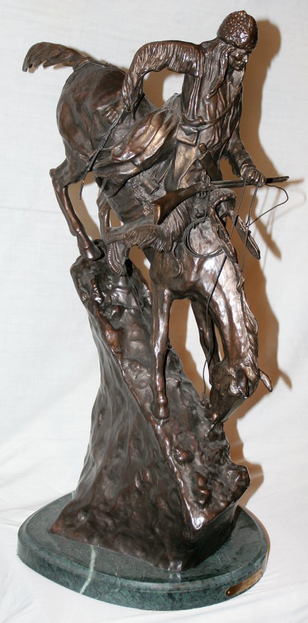 AFTER FREDERIC REMINGTON, BRONZE, H 26", L 17": AFTER FREDERIC REMINGTON, BRONZE, H 26", L 17", 'MOUNTAIN MAN':Mounted on a green marble base.
