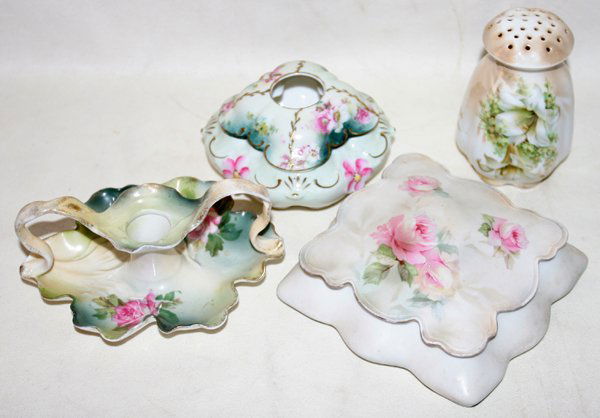 RS PRUSSIA BOX, HAIR RECEIVER, HATPIN HOLDER &: RS PRUSSIA BOX, HAIR RECEIVER, HATPIN HOLDER & CHAMBER STICK, C. 1900, FOUR PIECES, W 4"-6":Porcelain group includes 1 covered dresser box, W.5", 1 hair receiver, Dia.4", 1 hatpin holder, H.4", and 1