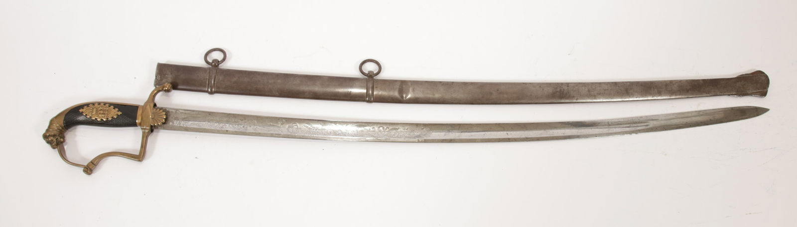GERMAN SWORD, BAVARIAN FRANCO-PRUSSIAN WAR C. 1837, L: GERMAN SWORD, BAVARIAN FRANCO-PRUSSIAN WAR C. 1837, L 37.5" OVERALL Having a Maximilian II crest to the handle with a lion form pommel. Having etched symbols and designs to the blade. Comes with scabb