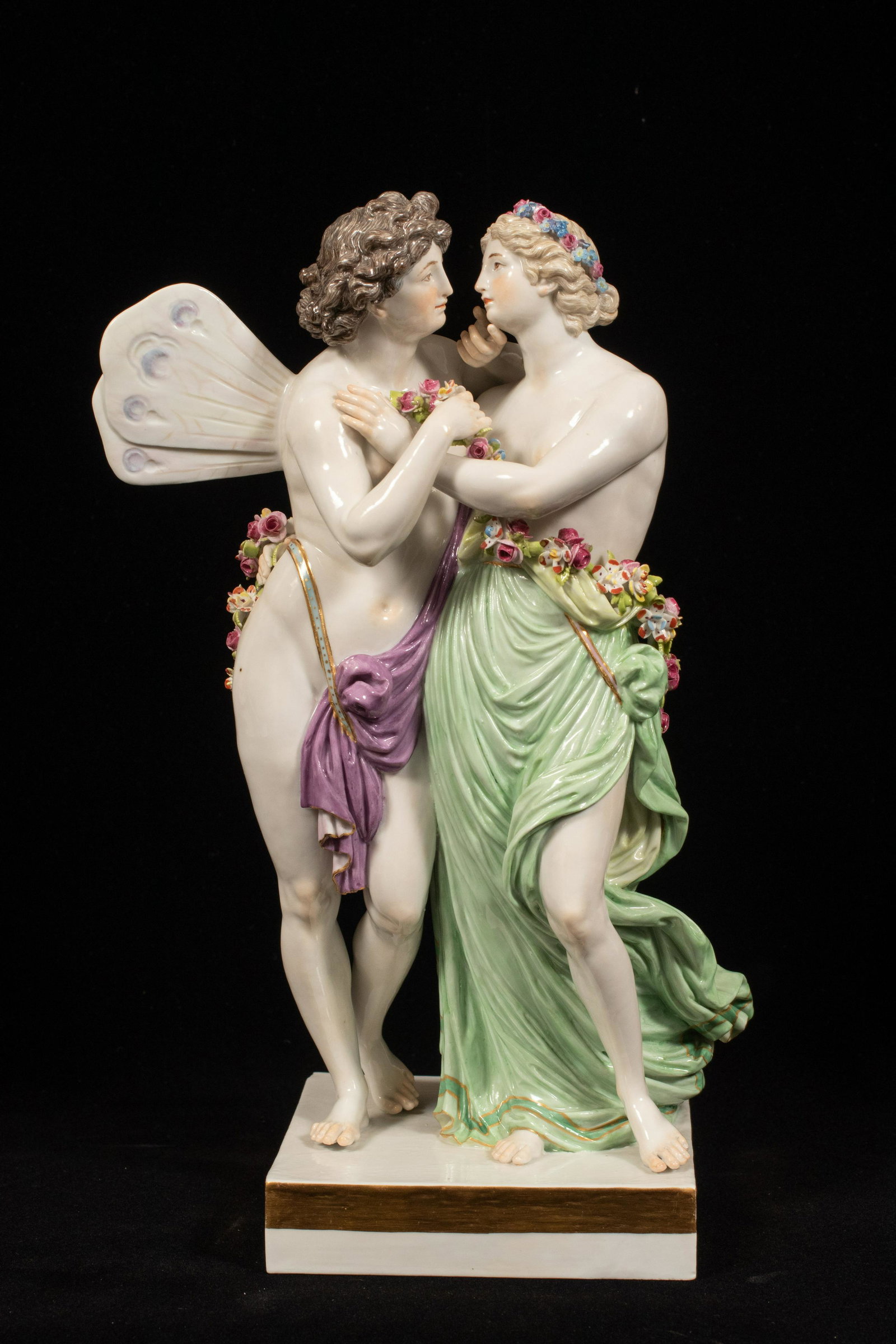 MEISSEN PORCELAIN EROS AND PSYCHE C 1900 H 11.25" W 6.": MEISSEN PORCELAIN EROS AND PSYCHE C 1900 H 11.25" W 6." Impressed 111Y, incised F10X, enamel 35, and the crossed swords scored through. Winged Eros stroking Psyche, both partially nude, both wrapped i