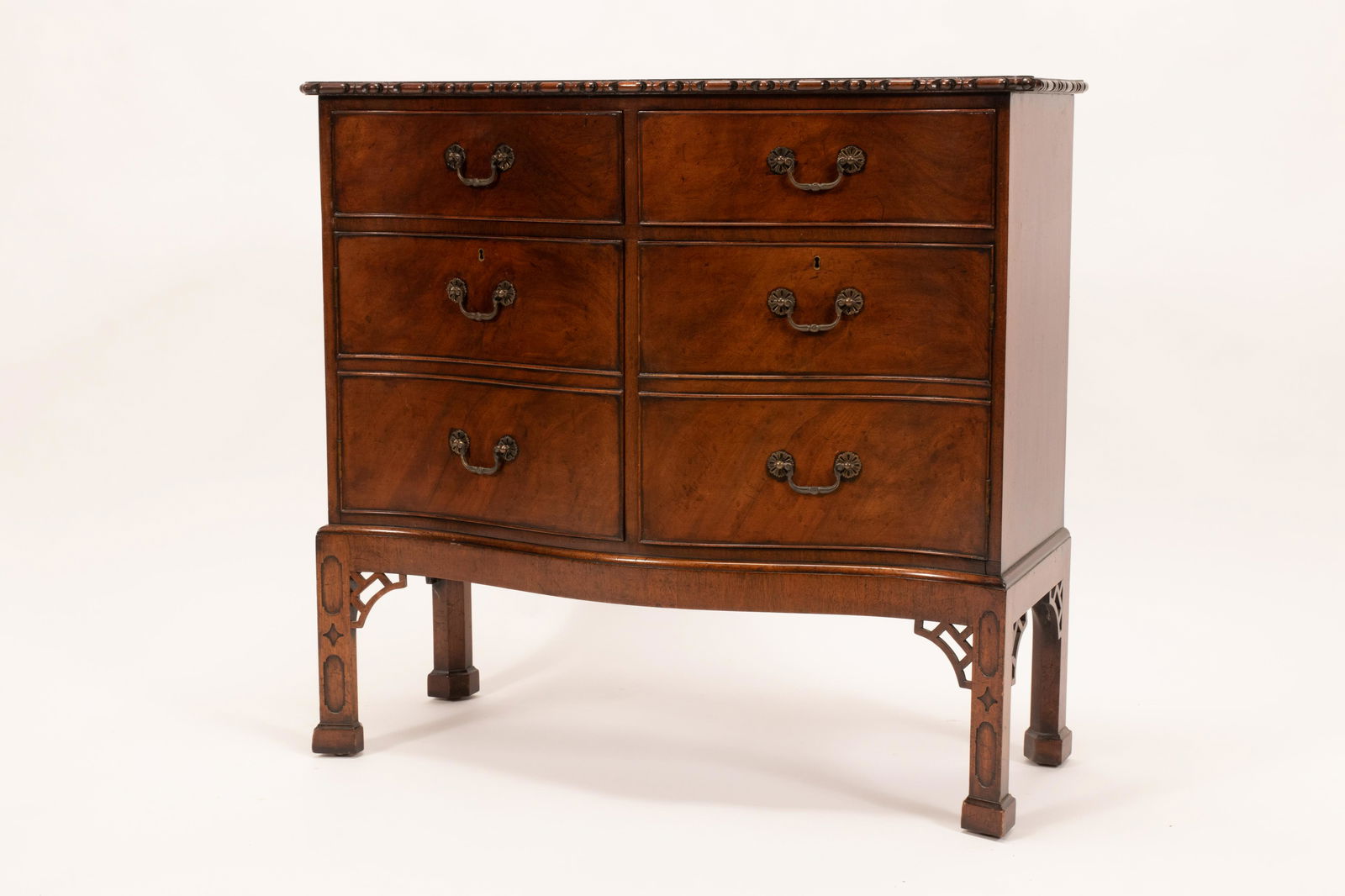 MODERN MAHOGANY COMMODE, H 36", W 38": MODERN MAHOGANY COMMODE, H 36", W 38" A modern mahogany commode. Offers a gadrooned top edge atop two drawers with two drawer form cabinet doors. Terminating on four spade feet. Depth 17".