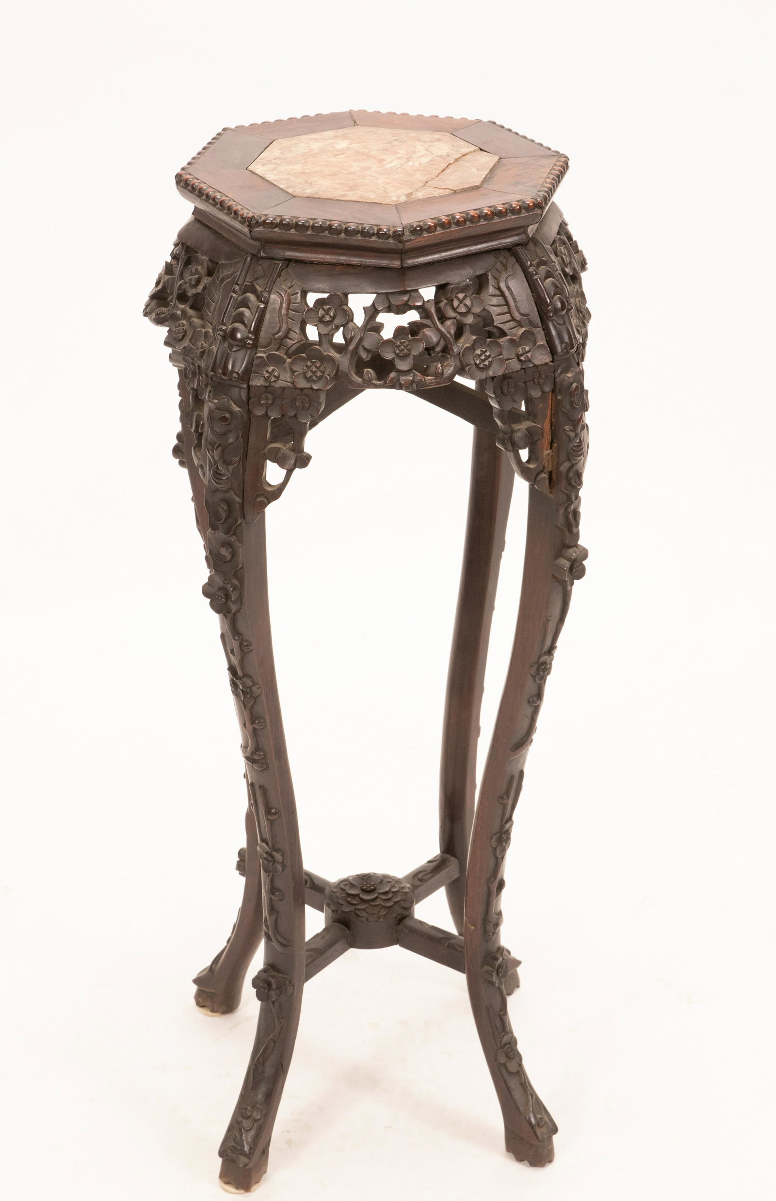 CHINESE TEAKWOOD PEDESTAL C 1900 H 36" DIA 15": CHINESE TEAKWOOD PEDESTAL C 1900 H 36" DIA 15" Hand-carved, prunus motif. Octagonal surface. Inset marble. From the estate of Gloria Anton, Grosse Pointe Shores, Mi.