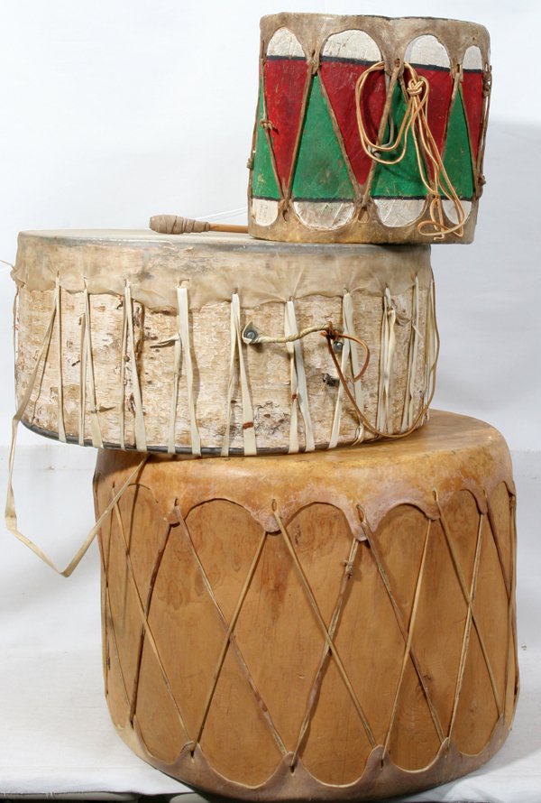 WOOD AND HIDE NATIVE AMERICAN DRUMS, THREE: WOOD AND HIDE NATIVE AMERICAN DRUMS, THREE:One drum is made of birch H 10", Dia 21 3/4" and includes a mallet; the second is made of pine with hide on both ends and includes a mallet; the third is a p