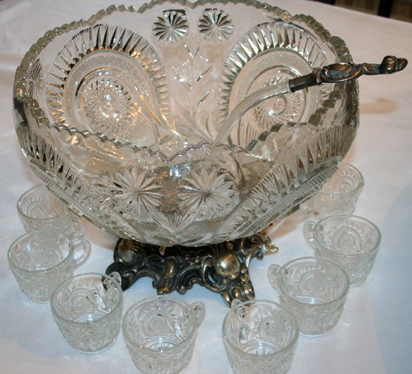 SILVER PLATE AND GLASS PUNCH BOWL SET, 14 PCS: SILVER PLATE AND GLASS PUNCH BOWL SET, 14 PIECES:Scroll & Fruit design on silver, flower pinwheel and fan design. 1 bowl with base, 1 ladle and 12 cups. Base marked Pitman, Dreitzer division of Lancas