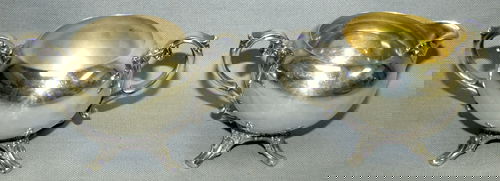 WM. ROGERS SILVER PLATE CREAMER & SUGAR: WM. ROGERS SILVER PLATE CREAMER AND SUGAR:Each on a four footed scroll base, with scroll handles.