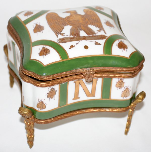 FRENCH NAPOLEONIC PORCELAIN BOX & STAND, H 5", : FRENCH NAPOLEONIC PORCELAIN BOX & STAND, H 5", W 6", L 6":Green, gold and white porcelain box, 5" H x 6" L. x 6" W. is clad with an eagle and bee pattern. Markings are over the glaze on the underside.