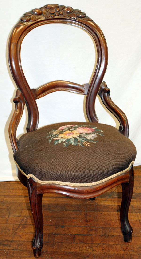 VICTORIAN WALNUT & NEEDLEPOINT SIDE CHAIR C1860: VICTORIAN WALNUT & NEEDLEPOINT SIDE CHAIR, C 1860:Needlepoint seat. Brown ground, floral motif. Carved crest in motif of cherries and nuts.