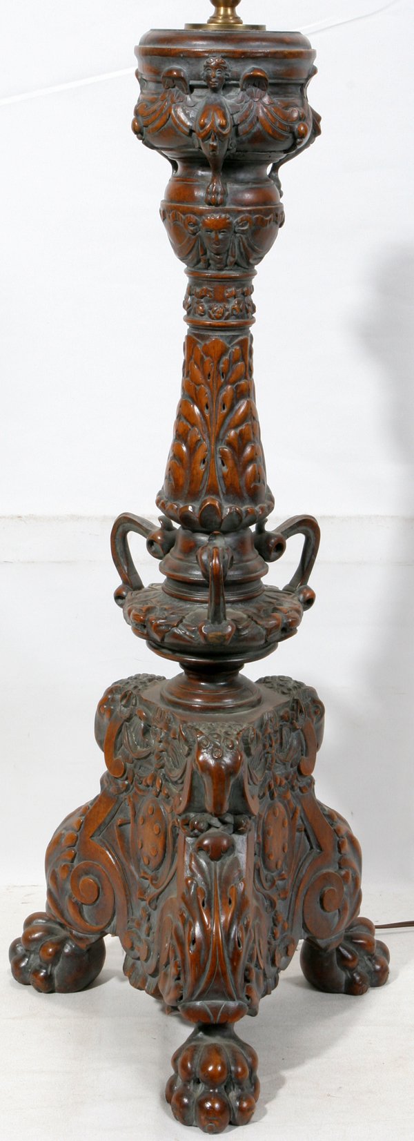ITALIAN CARVED WALNUT LAMP, C. 1900, H 28": ITALIAN CARVED WALNUT LAMP, C. 1900, H 28":Deep carving. Claw form feet. Motifs of floral swags