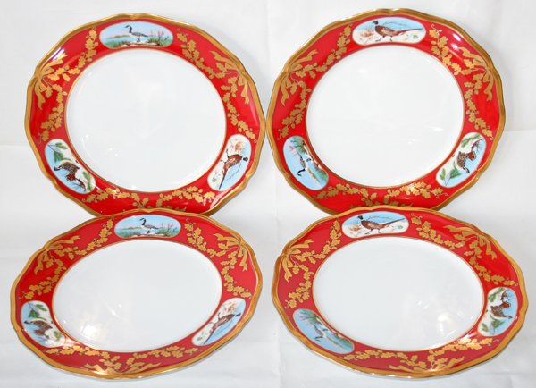 LYNN CHASE 'WINTER GAME BIRDS' PLATES, FOUR,: LYNN CHASE 'WINTER GAME BIRDS' PLATES, FOUR, DIA 10 1/4":Set of 4 porcelain plates, each having a red border with fired gold leaf and ribbon design.
