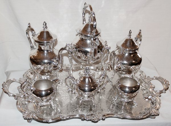 SILVERPLATE TEA & COFFEE SET WITH TRAY, 7 PCS: SILVERPLATE TEA & COFFEE SET WITH TRAY, SEVEN PIECES:hot water kettle on stand with alcohol burner, coffee pot, tea pot, sugar with cover, creamer, waste. Tray 28" and hand chased. All pieces are foot