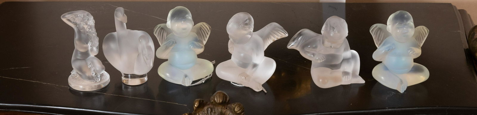LALIQUE GLASS CHERUB FIGURINES, 6 PCS, H 3": LALIQUE GLASS CHERUB FIGURINES, 6 PCS, H 3" Four cherubs, one nude, one swan. Opalescent. From a Grosse Pointe Shores estate.