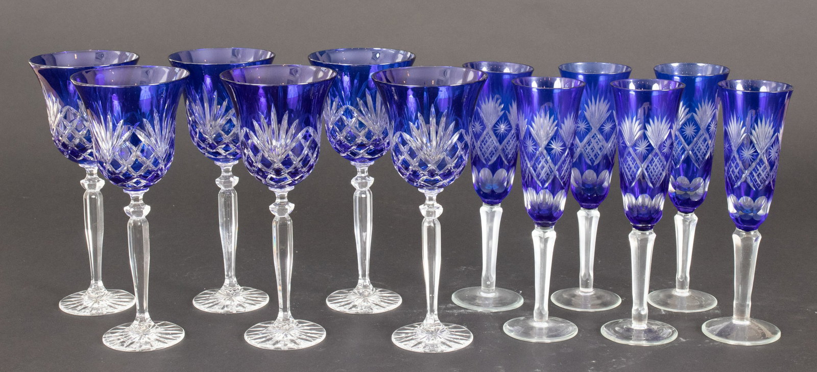 BLUE OVERLAY WINE & CHAMPAGNE GLASSES, 12 PCS, H: BLUE OVERLAY WINE & CHAMPAGNE GLASSES, 12 PCS, H 8.75"-9" Hand cut overlay crystal.There are six of each From a Grosse Pointe Shores estate.