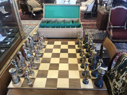 ANRI, ITALY CHESS SET, CARVED KNIGHTS, H 10.7", 32 PCS.: ANRI, ITALY CHESS SET, CARVED KNIGHTS, H 10.7", 32 PCS. Opulent chess set with a board, carved from alpine maple, hand-painted and gilded. Large version with a 10" king. In original shipping box. From