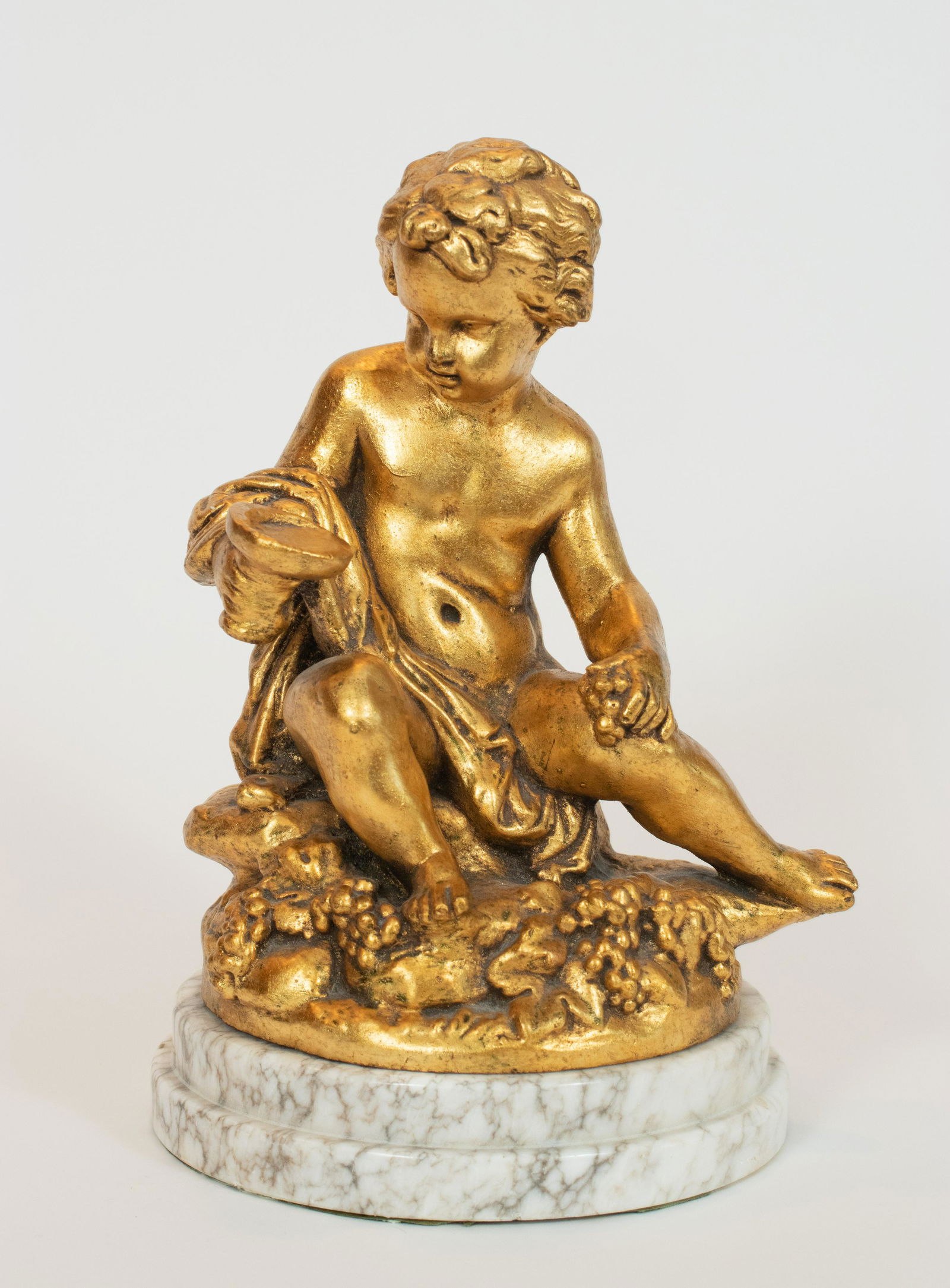 FLORENTINE STYLE GILT COMPOSITION CHERUB, H 11.7": FLORENTINE STYLE GILT COMPOSITION CHERUB, H 11.7" Composition. marble base. From a Grosse Pointe Shores estate.