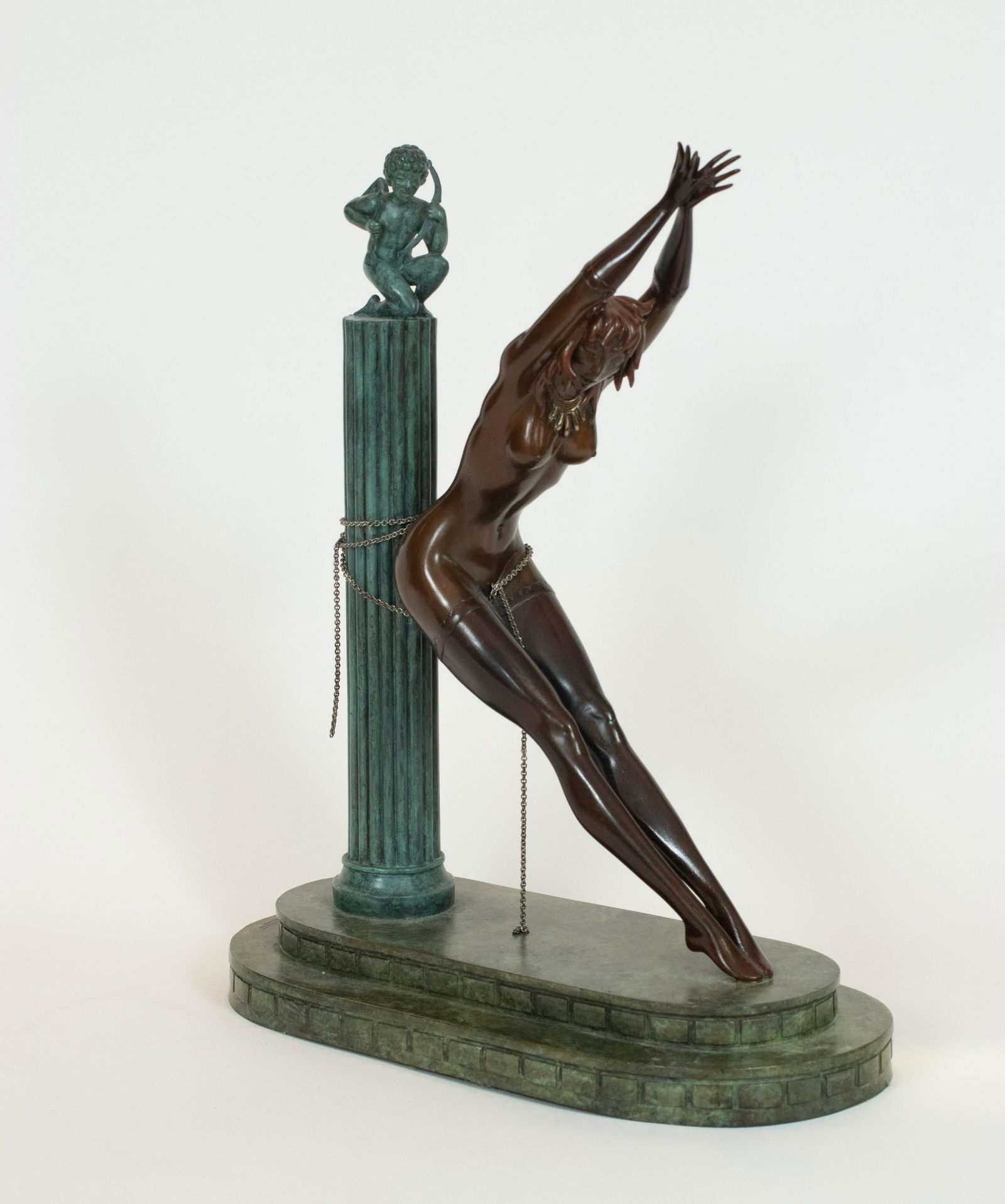 ERTE, BRONZE SCULPTURE, 1980 H 15.5", "PRISONER OF: ERTE, BRONZE SCULPTURE, 1980 H 15.5", "PRISONER OF LOVE, LETTER "K"", #141/250 C. 1980. Signed, numbered, and impressed with the artist's cipher and stamped with Meisner foundry mark. Green patina pil
