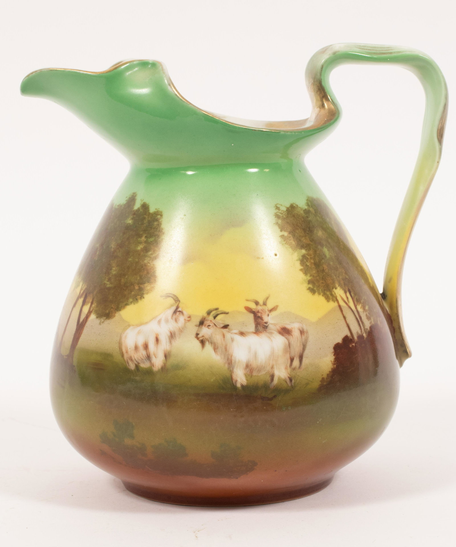 ROYAL BAYREUTH TAPESTRY PITCHER, GOATS C 1900 H 7.2" W: ROYAL BAYREUTH TAPESTRY PITCHER, GOATS C 1900 H 7.2" W 7.5" With trademark. Pastoral scene of goats. Gilt handle and rim.