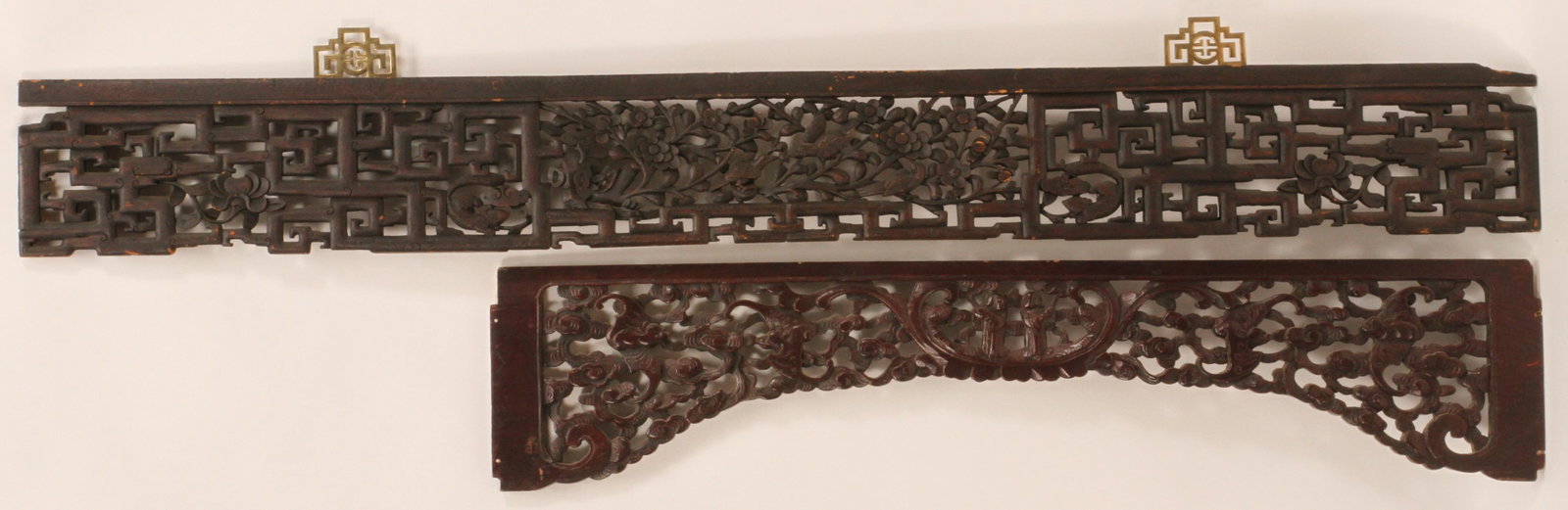 CHINESE CARVED WOOD WALL ORNAMENTS, 19TH.C. GROUP OF: CHINESE CARVED WOOD WALL ORNAMENTS, 19TH.C. GROUP OF TWO H 50"-72" W 10"-11" Provenance: From the garden of the Estate of Jack Faxon, Michigan Senator and creator of the Michigan Council for the Arts.