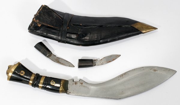 GURKHA KUKRI KNIFE AND SHEATH L 6" BLADE: GURKHA KUKRI KNIFE AND SHEATH L 6" BLADE:having an enamel painted handle with brass rings and lion mask pommel; also includes the smaller Karda (knife) and Chakmak (steel flint striker); having a tool