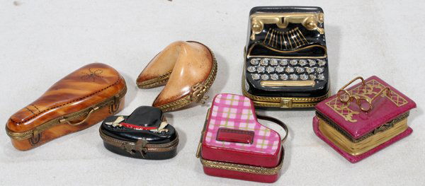 LIMOGES BOXES, TYPEWRITER, VIOLIN CASE ETC,: LIMOGES PORCELAIN BOXES, TYPEWRITER, VIOLIN CASE ETC, 6 PCS., H 1" - 3":includes a box with ice skate inside, box with horse latch and cowboy boots, typewriter, violin case with violin inside (as is),
