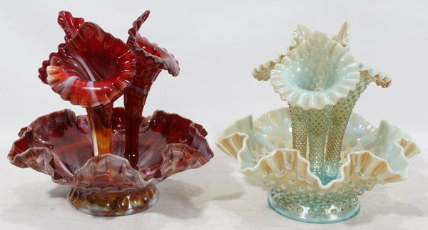 VICTORIAN STYLE GLASS EPERGNES, C. 1930, TWO,: VICTORIAN STYLE GLASS EPERGNES, C. 1930, TWO, H 9 3/4", W 9":Including one a mottled red, orange and white glass with three flori-form vases the other identically styled a light blue glass with opales