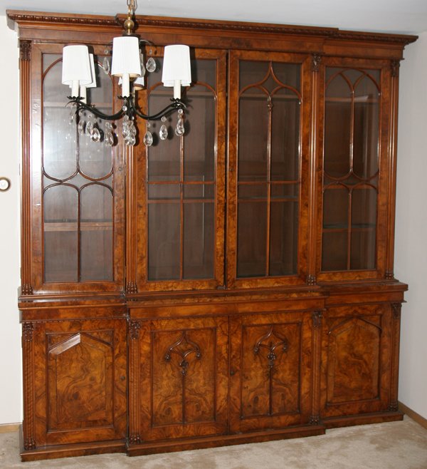 ENGLISH STYLE BURL WALNUT BREAKFRONT, H 94", : ENGLISH STYLE BURL WALNUT BREAKFRONT, H 94", W 92", D 20":Egg-and-dart cornice above 4 fennistrated doors opening to adjustable wood shelves, 4 cabinet doors at the base. Includes key.