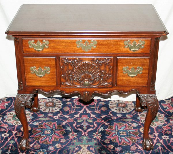 CHIPPENDALE STYLE MAHOGANY LOWBOY, C. 1940, : CHIPPENDALE STYLE MAHOGANY LOWBOY, C. 1940, H 31", W 35", D 21":Rectangular top with beveled edge and notched corners, fitted with a long drawer above three short drawers, shell motifs and scalloped a