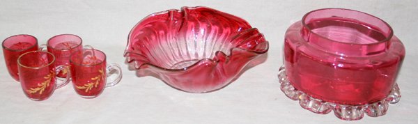 CRANBERRY GLASS DISHES (2) & LIQUOR CUPS (4): CRANBERRY GLASS DISHES (2) & LIQUOR CUPS (4), C. 1880:Including 2 dishes and 4 liquors. One dish 6" x 2 1/2" high, other dish dia 5" H 3". Four small liquor glasses with handles. Liquors originally ha