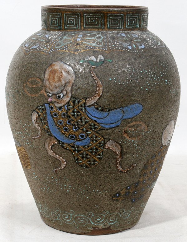 JAPANESE STONEWARE CERAMIC JAR ENAMEL DECORATED: JAPANESE STONEWARE CERAMIC JAR ENAMEL DECORATED, H 10", DIA 8":Enamel jar with whimsical motifs of frog, octopus and dome head man. base was drilled for lamp. Circa 1900 or earlier
