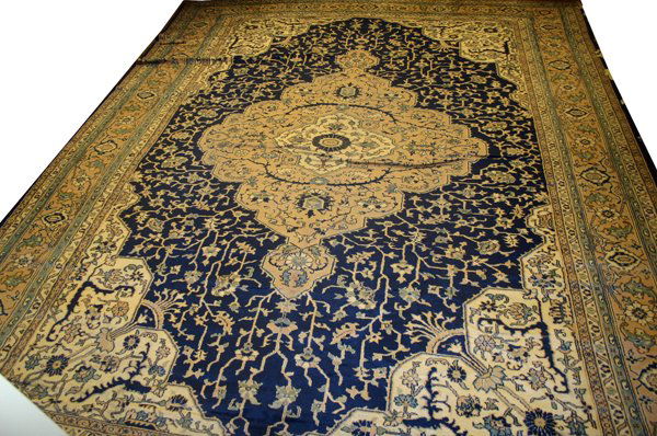 TURKISH SERPAI CARPET, C. 1920, 17' 4" X 12'0": TURKISH SERPAI CARPET, C. 1920, 17' 4" X 12' 0":A large medallion centers the navy ground, floral corners, within multiple borders.