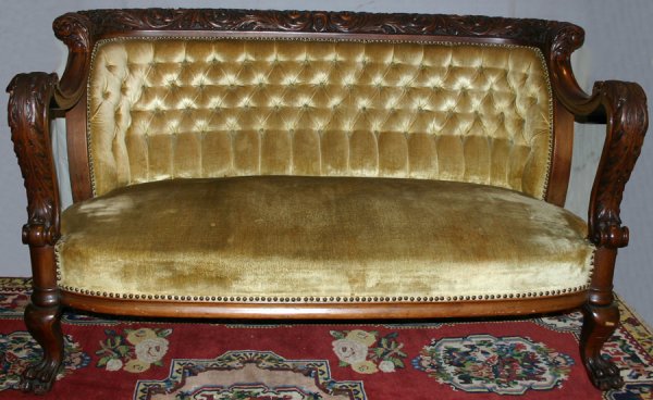 CARVED MAHOGANY PARLOR SETTEE C1880, H 36", : CARVED MAHOGANY PARLOR SETTEE C1880, H 36", W 60", D 32":heavily carved Floral & acanthus leaf scroll design to frame, armrests and legs. claw & paw feet; velvet upholstery, tufted seat back; having b
