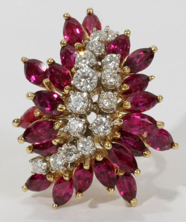 14KT GOLD, RUBY & DIAMOND PRINCESS RING: 14KT GOLD, RUBY & DIAMOND PRINCESS RING:A 14kt yellow gold ring set with 22 marquise cut rubies at 4. ct., and 15 diamonds at 1.5 ct.