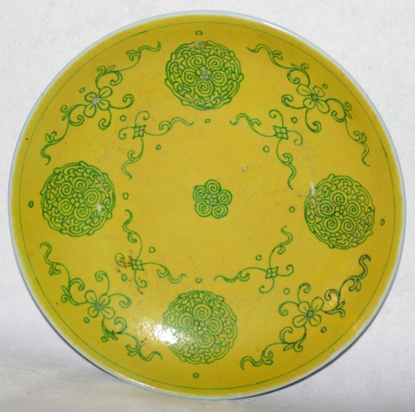 CHINESE CERAMIC DISH, ANTIQUE, DIA 10": CHINESE CERAMIC DISH, ANTIQUE, DIA 10":Lemon yellow well with green scroll motifs, orange sprigs on the underside. From the Estate of David Steinman, Bloomfield Hills, Michigan.