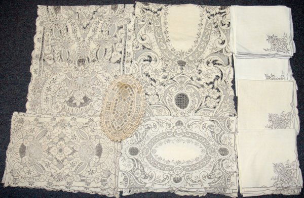 BELGIAN LACE TABLE RUNNERS, PLACEMATS & NAPKINS: BELGIAN LACE TABLE RUNNERS, PLACEMATS & NAPKINS, 38 PIECES (TWO SETS):Ecru linen and lace cut work including 8 placemats, 10" x 15 1/2", with a matching runner, 38" x 15 1/2", and 8 matching napkins,