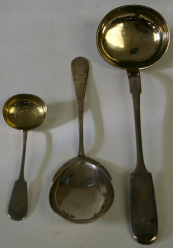 ESTONIAN & RUSSIAN .875 SILVER LADLES & SPOON,: ESTONIAN & RUSSIAN .875 SILVER LADLES & SPOON, EARLY 20TH CENTURY, THREE PIECES, L 6" - 12":Russian silver includes 1 small pierced ladle, with a monogrammed tip, stamped at the interior of the bowl w