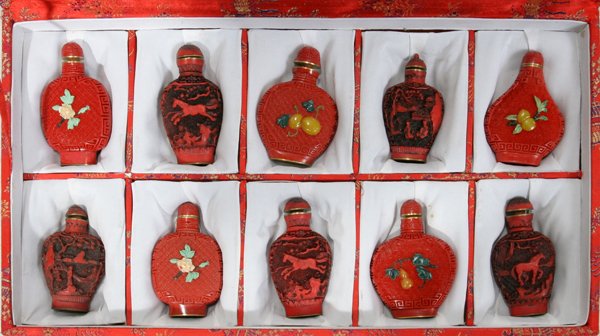 CHINESE CINNABAR SNUFF BOTTLES, 10 PCS., H 3": CHINESE CINNABAR SNUFF BOTTLES, 10 PCS., H 3":All are in Good condition. Five are inlaid with semi precious stones. Garden Scenes, Horses, Fruit and Flowers. Cranberry Red Cinabar Snuff Perfume Bottle