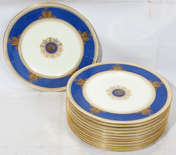 WEDGWOOD 'COLUMBIA' SERVICE PLATES, SET OF 12: WEDGWOOD 'COLUMBIA' SERVICE PLATES, SET OF 12, DIA 10 3/4":A set of 12 porcelain plates, "Columbia-Powder Blue" pattern, each having a bright blue border about an ivory well, fired gold griffin motif