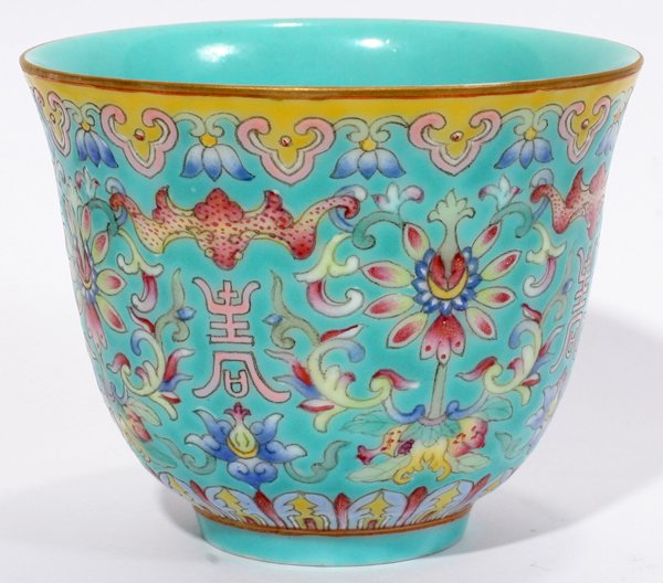 CHINESE PORCELAIN TEA CUP, H 2 3/4", DIA 3 3/8": CHINESE PORCELAIN TEA CUP, H 2 3/4", DIA 3 3/8":Light green ground with multi-colored bats, flowers and characters. Stamped on underside.