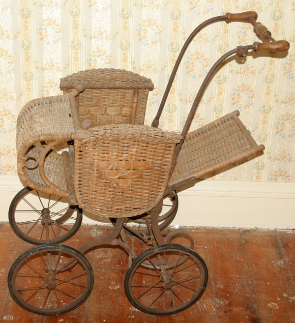 EDWARDIAN WICKER & IRON PRAM, H 35", L 32": EDWARDIAN WICKER & IRON PRAM, H 35", L 32":Turned wood handles, reclining seat.