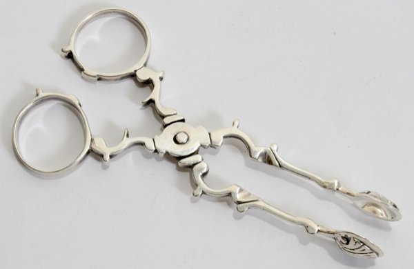 LIONEL A. CRICHTON STERLING SUGAR NIPPERS, L 4": LIONEL A. CRICHTON STERLING SUGAR NIPPERS, LONDON, 1925-26, L 4":Scissor style, hallmarks include a lion passant, uncrowned leopard, date letter "k", and maker's mark "LAC" enclosed, also stamped "Mad