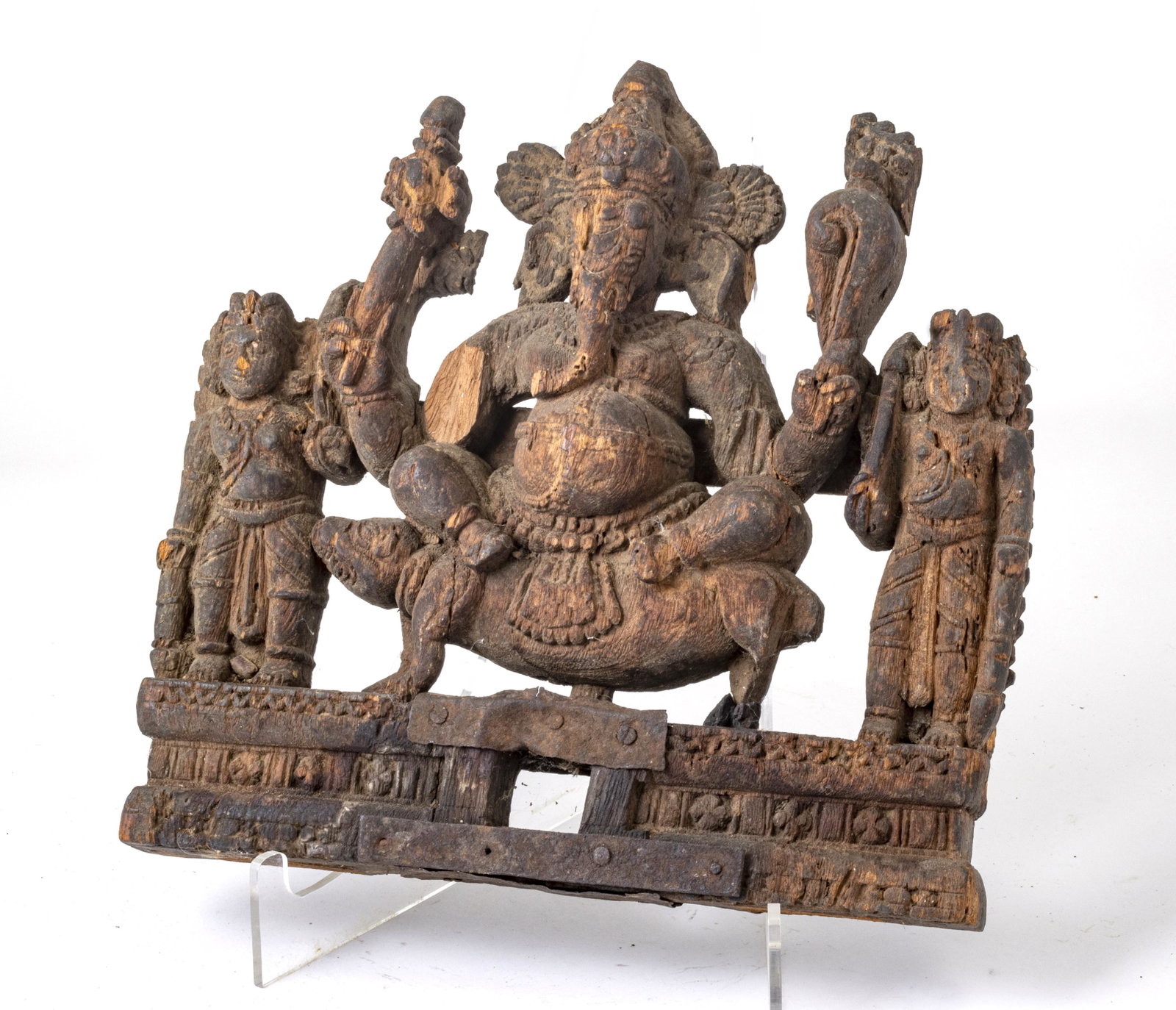 INDIA CARVED WOOD GANESHA WITH PIGMENT: INDIA CARVED WOOD GANESHA WITH PIGMENT, 19TH CENTURY H 11" W 11" Antiquity depicting god Ganesha flanked by attendants. Provenance: From the Estate of John Willard Spellman, PH.D., F.R.A.S. Dr. Spellm