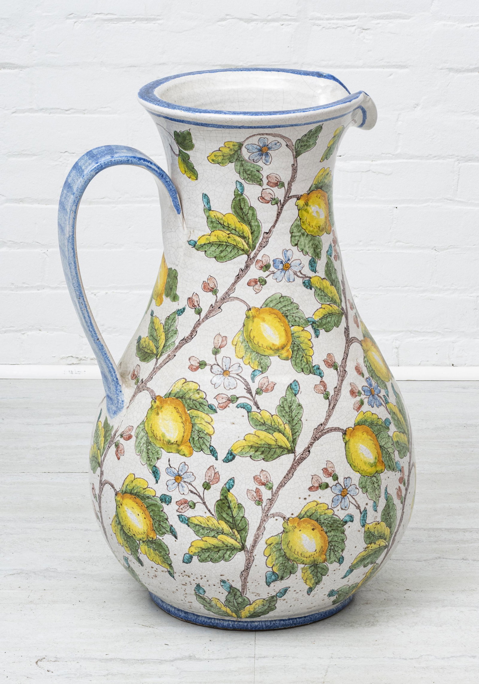 SIENA, ITALY MAGNUM HAND CRAFTED POTTERY PITCHER: SIENA, ITALY MAGNUM HAND CRAFTED POTTERY PITCHER H 27" W 17" "Dipinto a Mano, Antica Siena" or Made by hand. Colorful motif of lemons, yellow and blue.