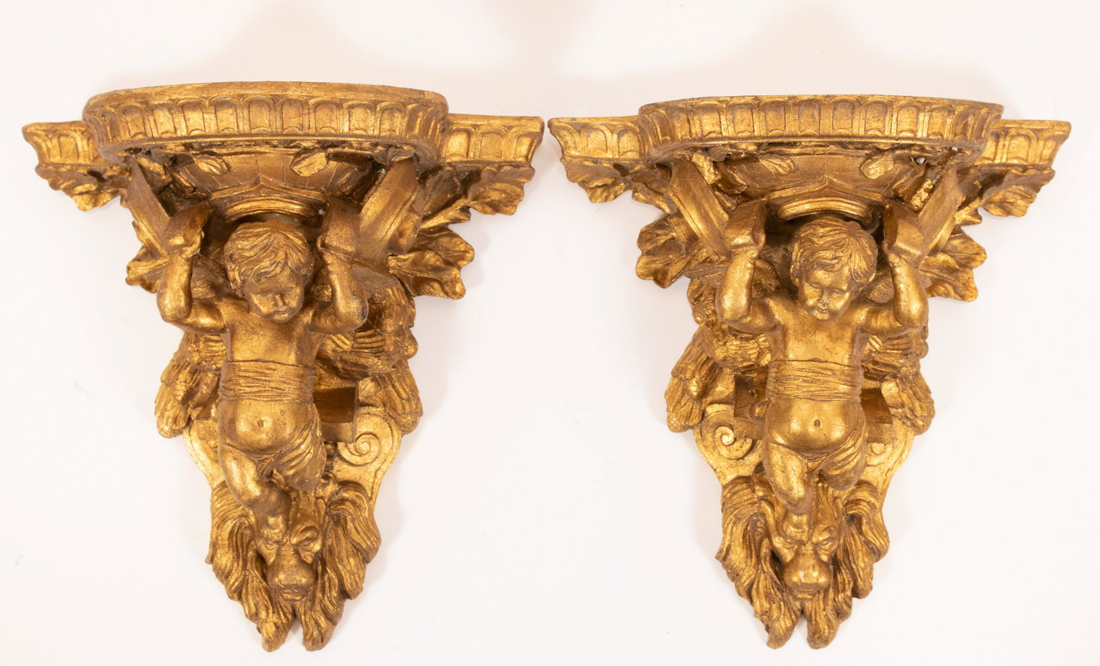 GILT WOOD AND GESSO WALL DISPLAY SHELVES PAIR: GILT WOOD AND GESSO WALL DISPLAY SHELVES PAIR, H 12", W 12"A pair of gilt wood wall pedestals. Depth 6.5". Chereub motif.