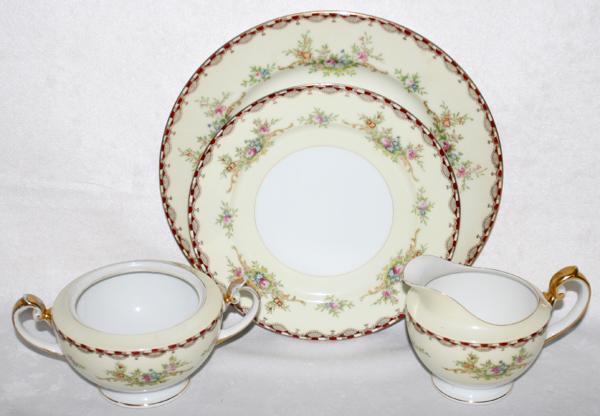 JAPANESE PORCELAIN DINNER SERVICE, 23 PIECES: JAPANESE PORCELAIN DINNER SERVICE, 23 PIECES:Marked "Meito China N.S.P. Made in Japan Hand Painted". Including 11 dinner plates, Dia. 9 3/4", 10 dessert plates, Dia. 7 7/8", 1 creamer and 1 sugar bowl