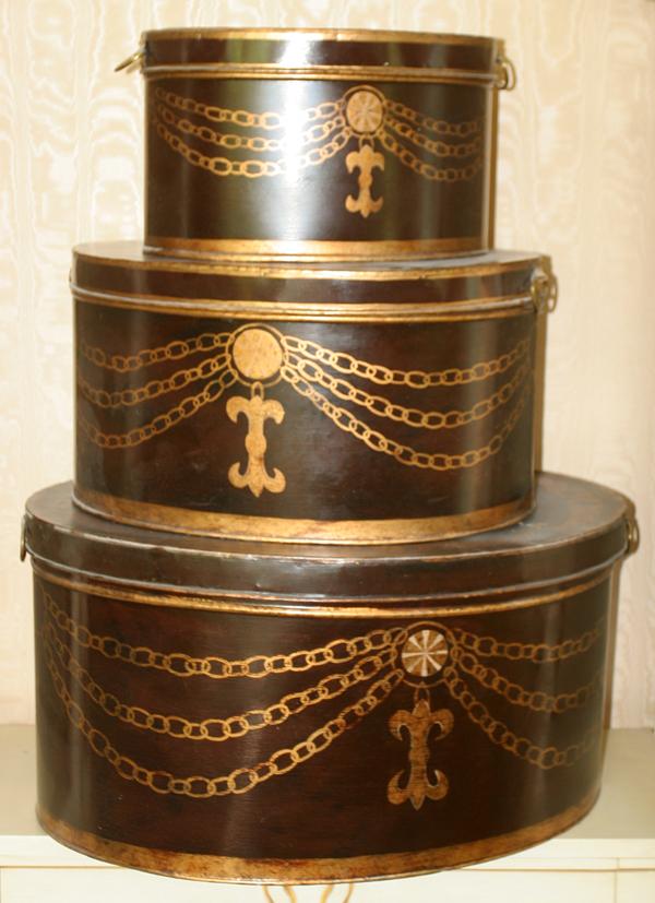 TOLE STYLE DECORATIVE BOXES, SET OF THREE,: TOLE STYLE DECORATIVE BOXES, SET OF THREE, H 15", L 29" (LARGEST):Oval shape, graduated size, the largest of which measures H.15" x 29" x 23".