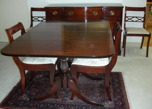 FEDERAL STYLE MAHOGANY DINING TABLE, BUFFET, &: FEDERAL STYLE MAHOGANY DINING TABLE, BUFFET, & 4 CHAIRS, C. 1940:Includes Duncan Phyfe drop leaf table, one extra leaf and pads, buffet with six drawers and two cabinets. Four chairs. Circa 1940 Prope