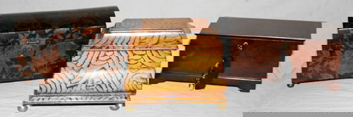 DECORATIVE BOXES: DECORATIVE BOXES, THREE, L 10", 11", & 12":Including 1 black 12" box with orange flower motifs , dome lid and footed; 1 mahogany jewelry box 11" with key attached to tassel, and 1 faux painted yellow