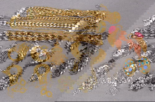 MONET , HOBÉ & OTHER COSTUME JEWELRY: MONET , HOBÉ, YVES ST. LAURENT AND OTHER COSTUME BRACELETS AND EARRINGS 15PCS.:Including 3 Monet multi strand gold colored chain bracelets L 7", 1 having tassel; 1 Yves St. Laurent gold colored earri