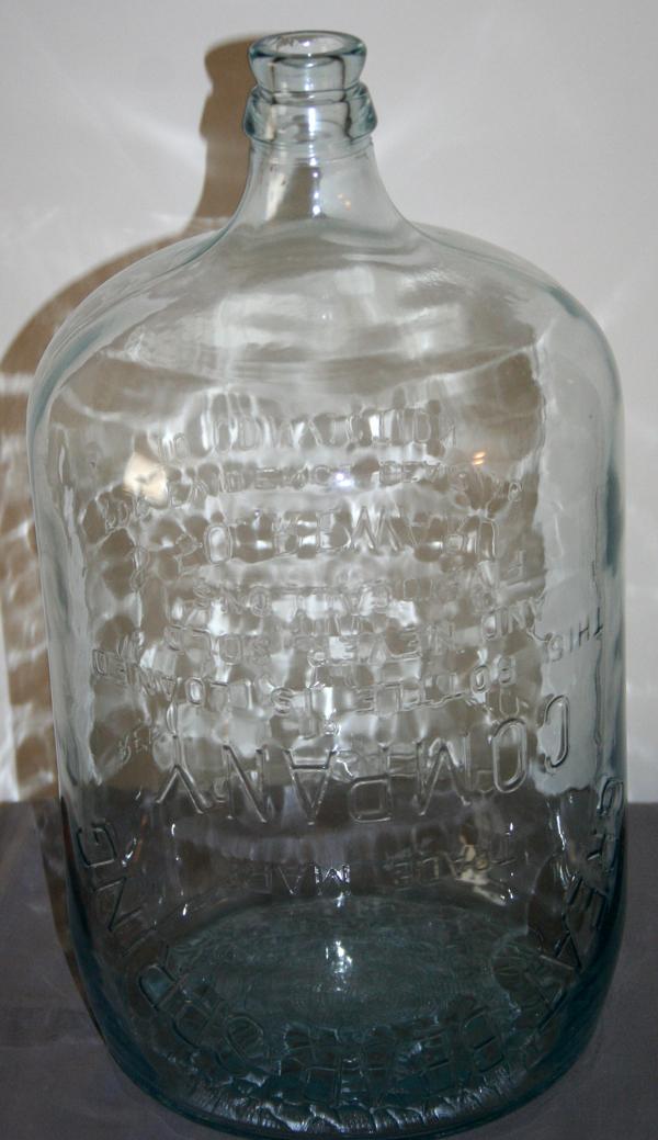 GREAT BEAR SPRING CO. GLASS WATER JUG, C 1900: "GREAT BEAR SPRING CO." GLASS WATER JUG, C 1900, H 20", DIA 10":molded glass jar with inscriptions on sides "Great Bear Spring Company";