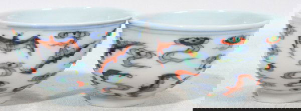 CHINESE PORCELAIN TEA CUPS, TWO, H 1 1/2",: CHINESE PORCELAIN TEA CUPS, TWO, H 1 1/2", DIA 2 3/8":White ground with multi-colored bat and cloud design. Stamped on underside.