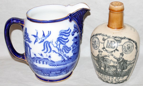 DOULTON 'WILLOW' PITCHER & H. KENNEDY JUG, H 7": DOULTON 'WILLOW' PITCHER & H. KENNEDY OF GLASGOW JUG, H 7":Including 1 antique Doulton pitcher, decorated in blue under glaze, H.7", and 1 Kennedy stoneware Heather Den whiskey jug, H.7 1/2". Two piec